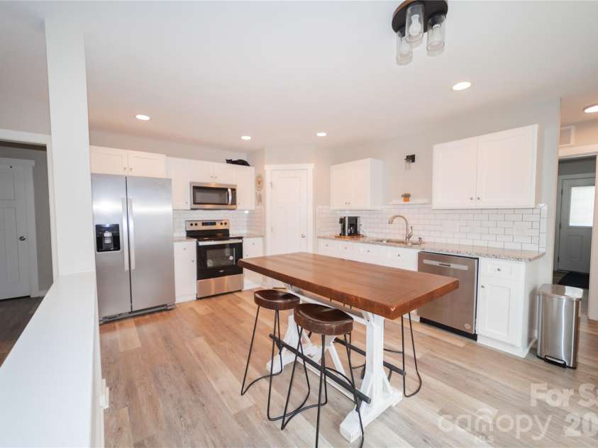 1338 Eastside Avenue, Albemarle, NC 28001.  MLS# CAR4342335, YatesRealty ID 3238. Open to the living area, this kitchen is perfect for entertaining and staying connected.