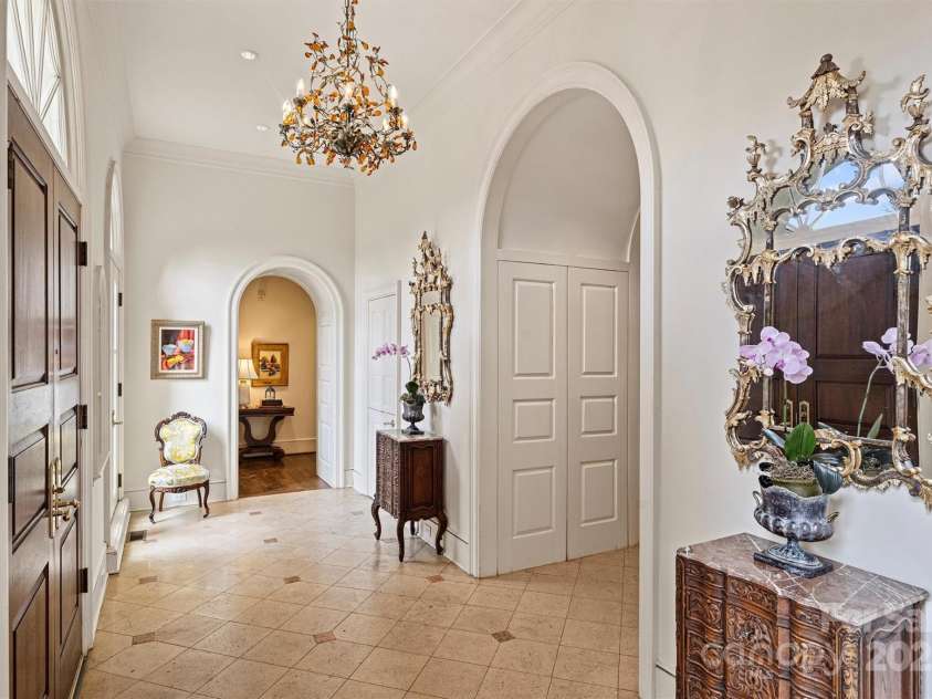 318 Canterbury Road, Charlotte, NC 28211.  MLS# CAR4231857, YatesRealty ID 3238. As you enter through the grand foyer, you're greeted by 12-foot ceilings and wide paneled archways that lead you into the expansive living room.