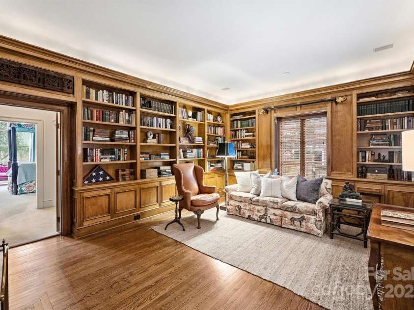 318 Canterbury Road, Charlotte, NC 28211.  MLS# CAR4231857, YatesRealty ID 3238. Rich wood paneling and custom built-ins establish a cozy ambiance in the sophisticated study.