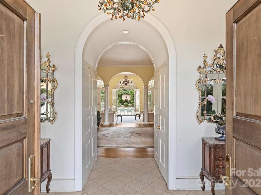 318 Canterbury Road, Charlotte, NC 28211.  MLS# CAR4231857, YatesRealty ID 3238. Spanning 4,718 square feet, this custom home perfectly embodies classical French architecture with its harmonious proportions and graceful curves.