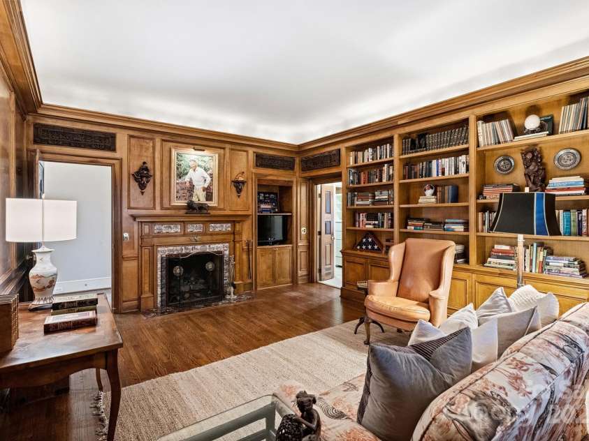 318 Canterbury Road, Charlotte, NC 28211.  MLS# CAR4231857, YatesRealty ID 3238. The home also offers a sophisticated study, reflecting the international influence of its original owners - Dutch delft sepia tile surrounding the cozy, gas fireplace and three hand-carved wood panels from Nepal.