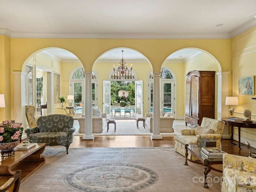 318 Canterbury Road, Charlotte, NC 28211.  MLS# CAR4231857, YatesRealty ID 3238. The home was built with entertaining in mind, which you notice the moment you step inside. The central axis leads the eye through generous reception rooms, to the terrace and pool, and finally to a thriving, lush garden