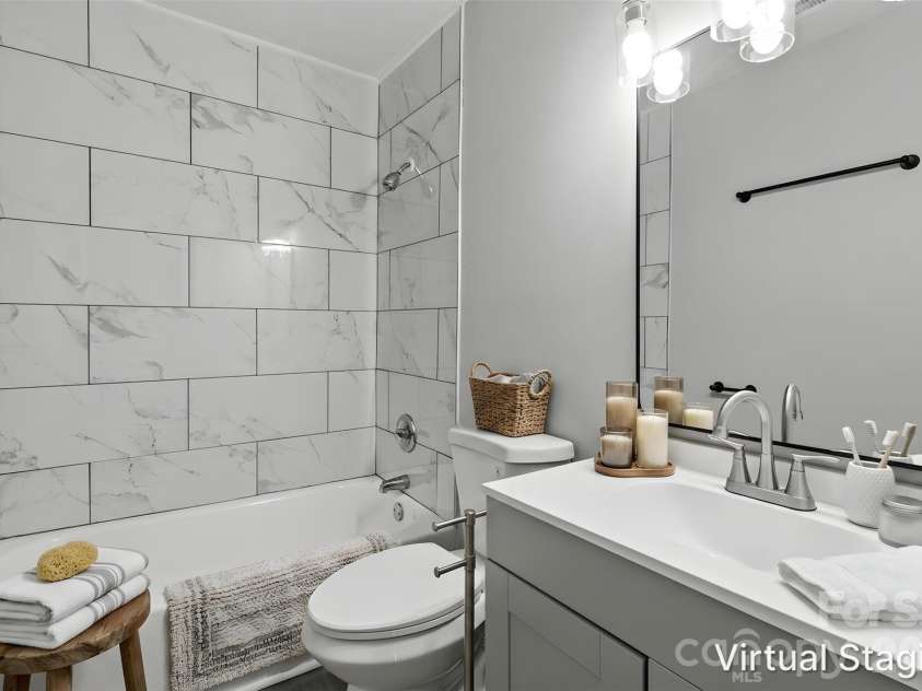 2725 Thornton Road, Charlotte, NC 28208.  MLS# CAR4394412, YatesRealty ID 32383. Full bath central to the home/all bedrooms. Highlights include updated vanity & tile-wall surround for tub/shower (virtually staged & enhanced).