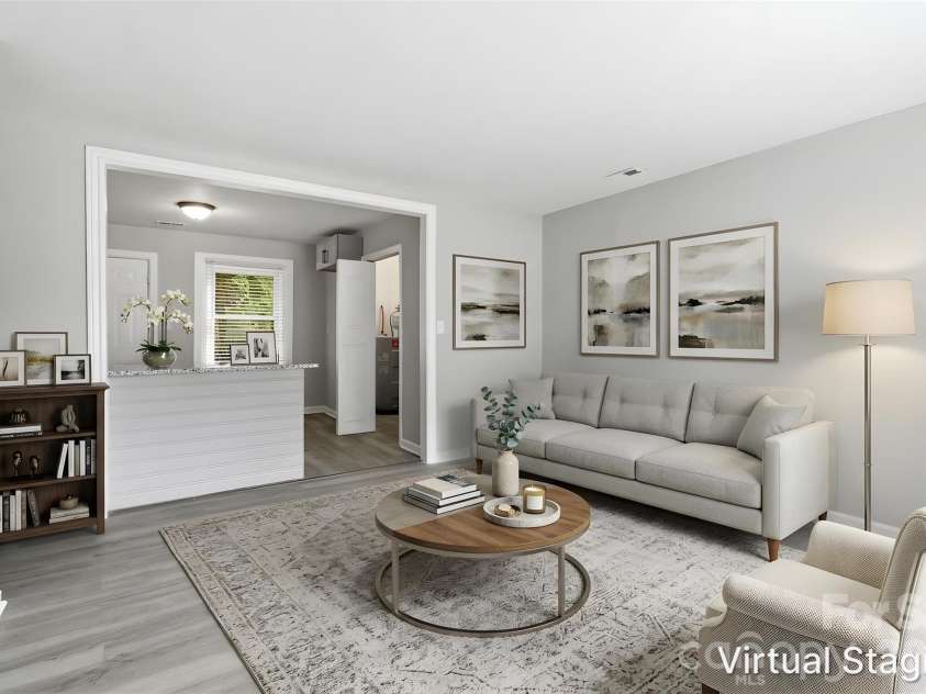 2725 Thornton Road, Charlotte, NC 28208.  MLS# CAR4394412, YatesRealty ID 32383. Walking into the expansive living room (virtually staged & enhanced).