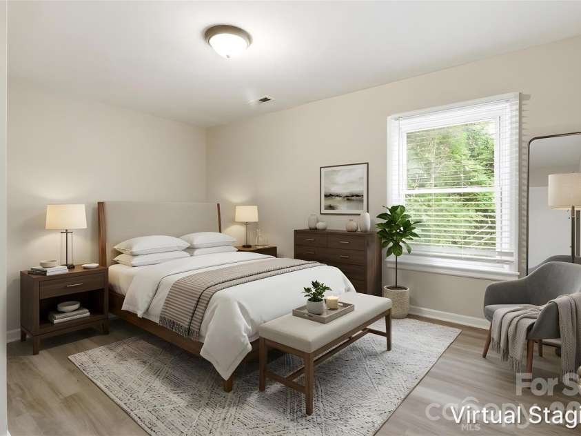 2725 Thornton Road, Charlotte, NC 28208.  MLS# CAR4394412, YatesRealty ID 32383. Walking into the primary bedroom (virtually staged & enhanced).