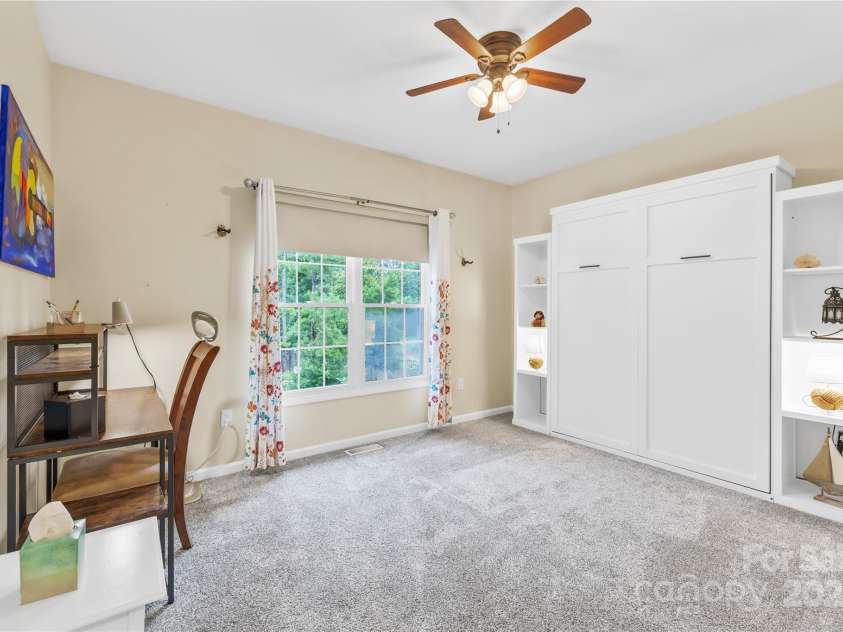 22312 John Gamble Road, Cornelius, NC 28031.  MLS# CAR4289564, YatesRealty ID 32384. Bedroom with Murphy bed up...lots of space