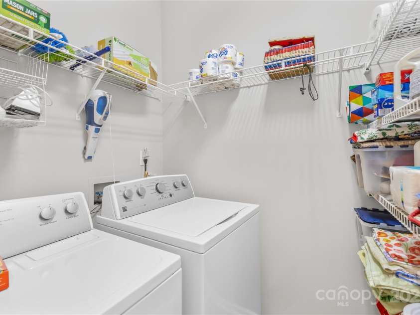 22312 John Gamble Road, Cornelius, NC 28031.  MLS# CAR4289564, YatesRealty ID 32384. Large laundry room - Washer and Dryer stay with the home.