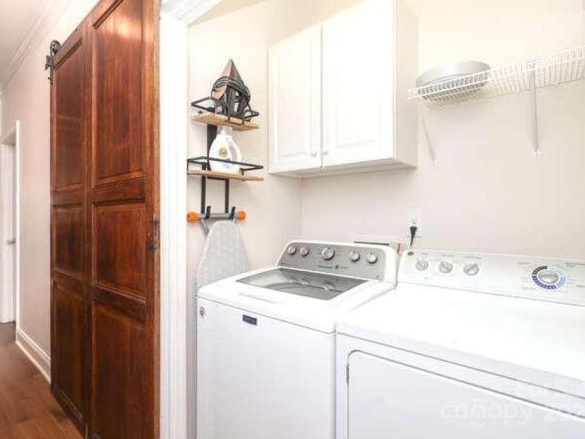 16037 Stonemont Road, Huntersville, NC 28078.  MLS# CAR4279045, YatesRealty ID 32385. Laundry with antique sliding door