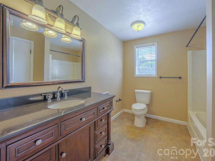 35 Coweeta Ridge Road, Otto, NC 28763.  MLS# CAR4395069, YatesRealty ID 32389. Lower Level Bath