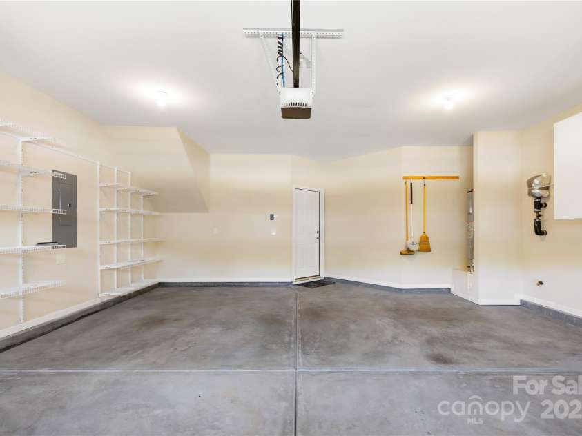 135 Valleymist Lane, Mooresville, NC 28117.  MLS# CAR4278379, YatesRealty ID 32395. Garage has built in cabinets and shelving