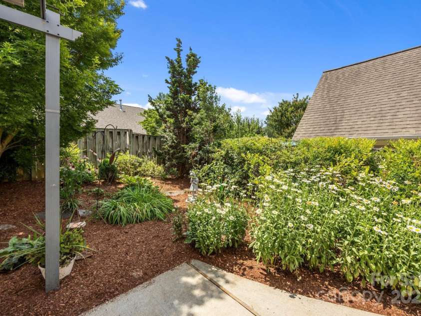 8 Beekeeper Trail, Swannanoa, NC 28778.  MLS# CAR4280414, YatesRealty ID 32396. More perennial flowers off the patio-