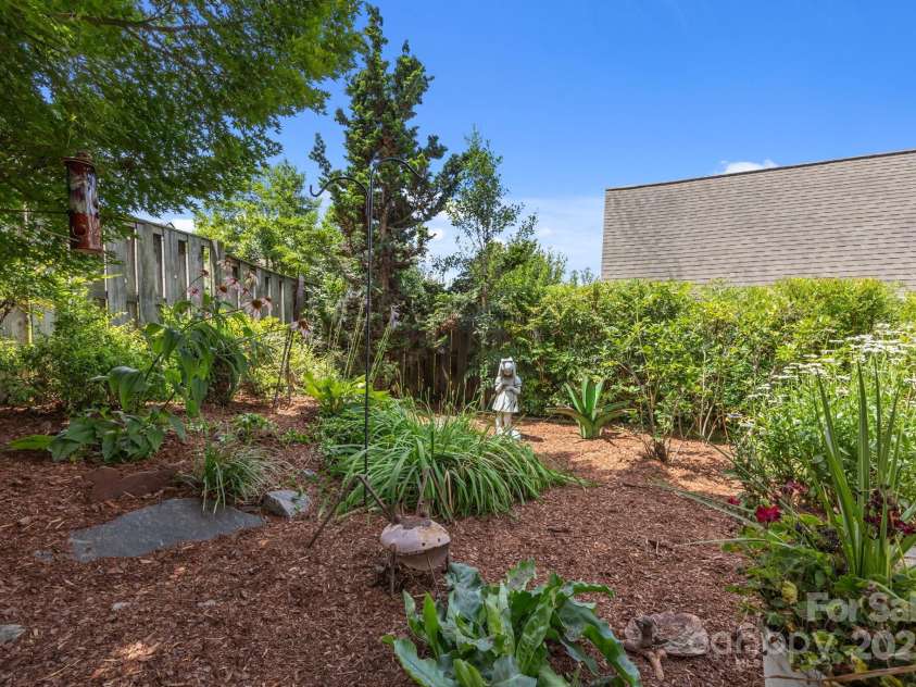 8 Beekeeper Trail, Swannanoa, NC 28778.  MLS# CAR4280414, YatesRealty ID 32396. Naturalized and established gardens to watch the pollinators-