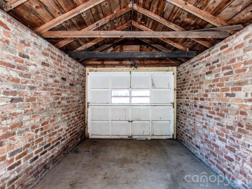 801 4th Street, Spencer, NC 28159.  MLS# CAR4392657, YatesRealty ID 32398. Garage Interior – Block Bay