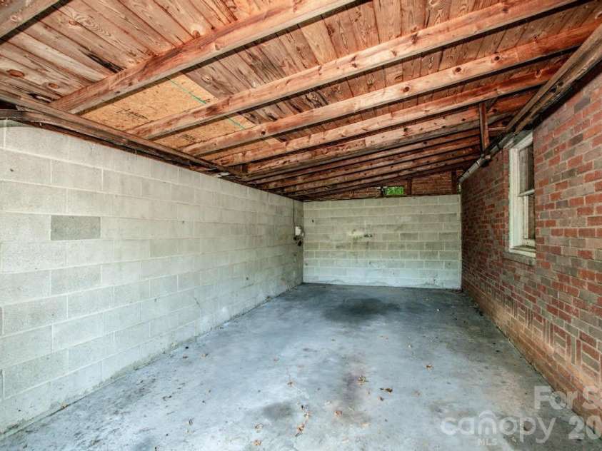801 4th Street, Spencer, NC 28159.  MLS# CAR4392657, YatesRealty ID 32398. Garage Interior – Block Bay