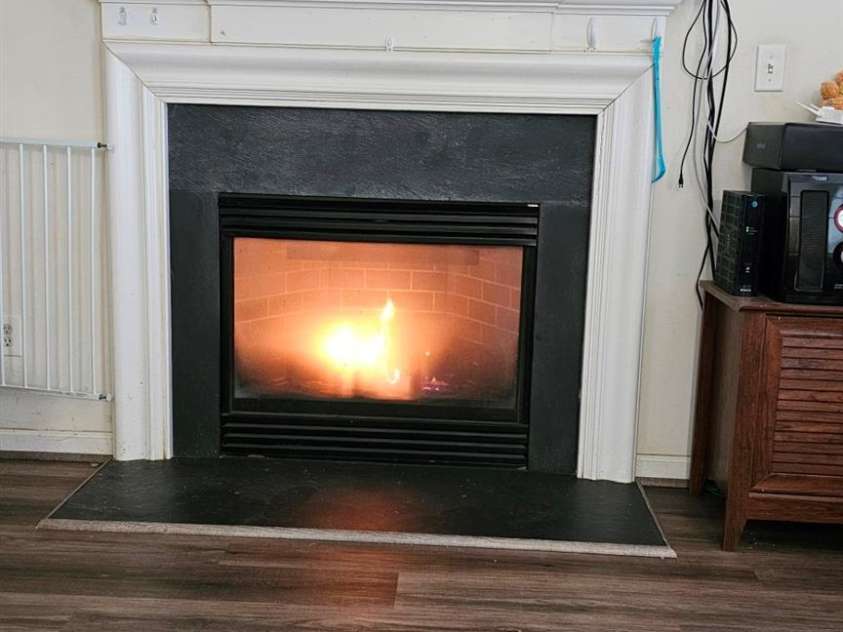 6334 Dillard Ridge Drive, Charlotte, NC 28216.  MLS# CAR4206693, YatesRealty ID 324. Fireplace in the den.