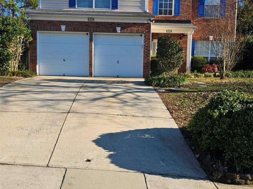 6334 Dillard Ridge Drive, Charlotte, NC 28216.  MLS# CAR4206693, YatesRealty ID 324. Front of the from middle of the street.
