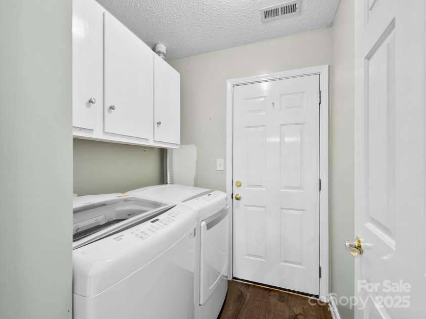 42 Morning Mist Road, Fletcher, NC 28732.  MLS# CAR4292025, YatesRealty ID 32410. Laundry room is accessed near kitchen and is also the entry to the attached garage.