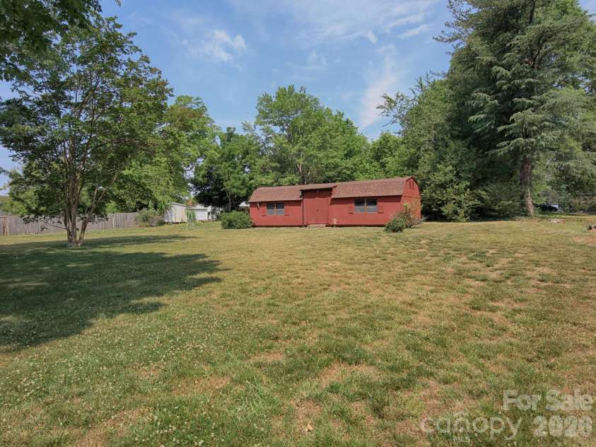 1005 Forest Park Drive, Statesville, NC 28677.  MLS# CAR4374714, YatesRealty ID 32415. Storage Building in Backyard