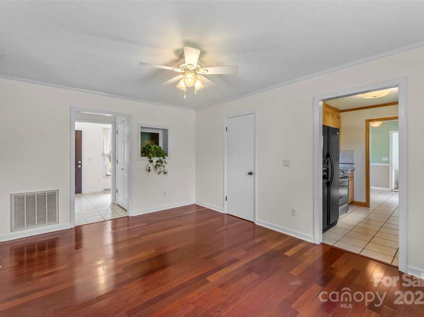 2423 Warrior Fork Trail, Morganton, NC 28655.  MLS# CAR4285223, YatesRealty ID 32420. Dining Room looking toward the front foyer which features two closet, basement door, kitchen