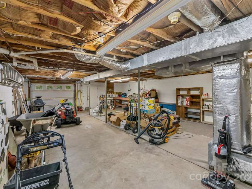 2423 Warrior Fork Trail, Morganton, NC 28655.  MLS# CAR4285223, YatesRealty ID 32420. HVAC unit is a recent replacement item in this clean drive in or walk in basement