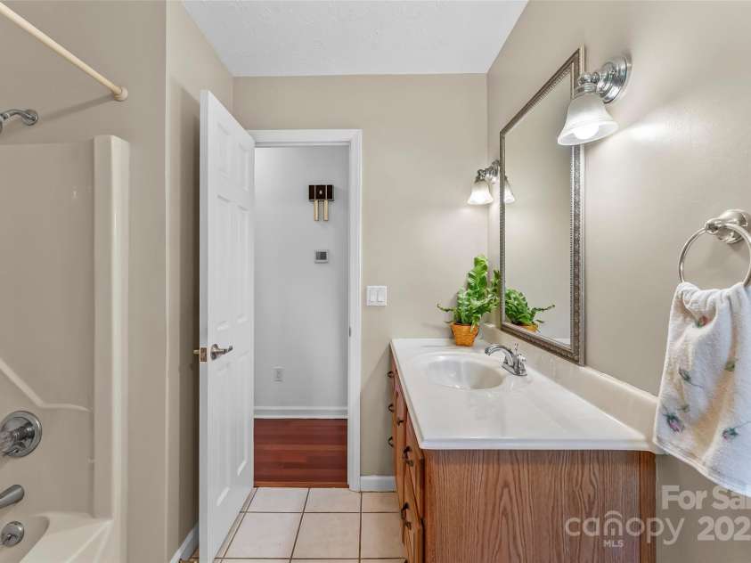 2423 Warrior Fork Trail, Morganton, NC 28655.  MLS# CAR4285223, YatesRealty ID 32420. Laundry room off of the kitchen, is a mud room between garage, porches and main home. Appliances convey.