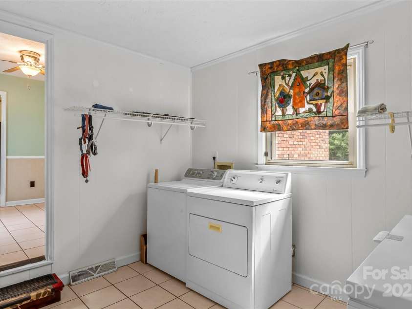 2423 Warrior Fork Trail, Morganton, NC 28655.  MLS# CAR4285223, YatesRealty ID 32420. Laundry room off of the kitchen, is a mud room between garage, porches and main home. Appliances convey.