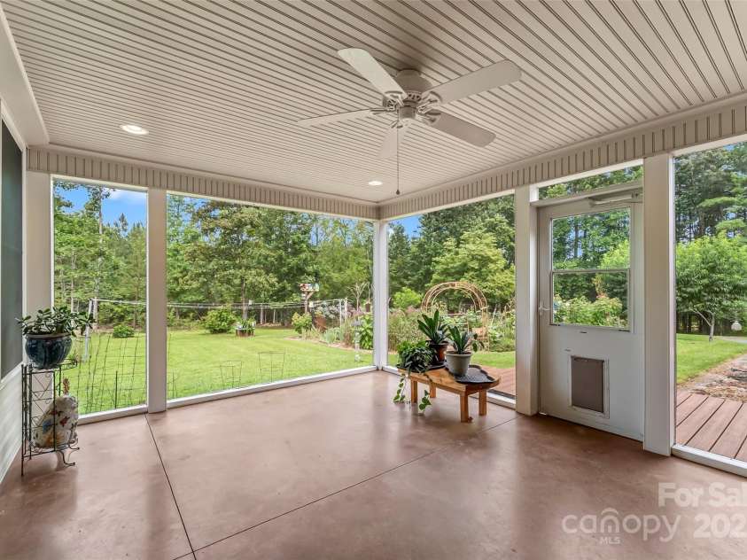 2423 Warrior Fork Trail, Morganton, NC 28655.  MLS# CAR4285223, YatesRealty ID 32420. Screened porch off of the laundry room looking  toward the garden