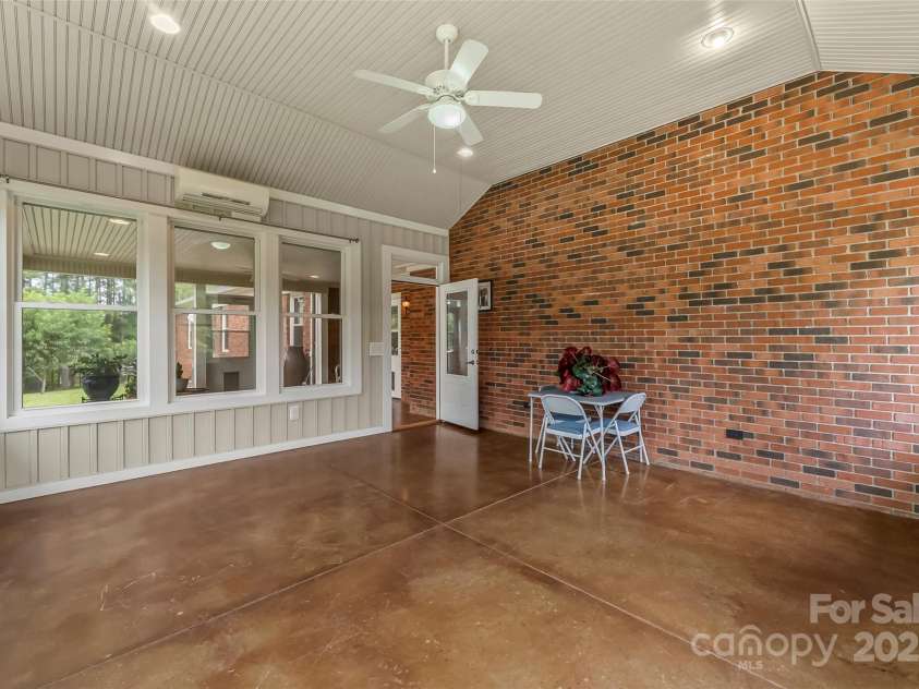 2423 Warrior Fork Trail, Morganton, NC 28655.  MLS# CAR4285223, YatesRealty ID 32420. Sunroom looking inward toward the home and screened porch