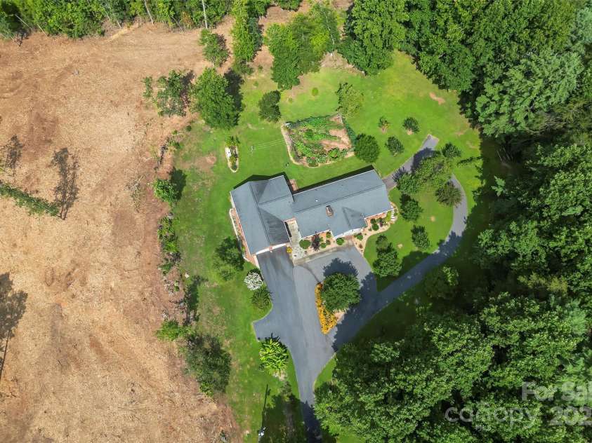 2423 Warrior Fork Trail, Morganton, NC 28655.  MLS# CAR4285223, YatesRealty ID 32420. The 1.4 acre parcel beside the main home was recently logged and mulched to clear off Hurricane Helene damage