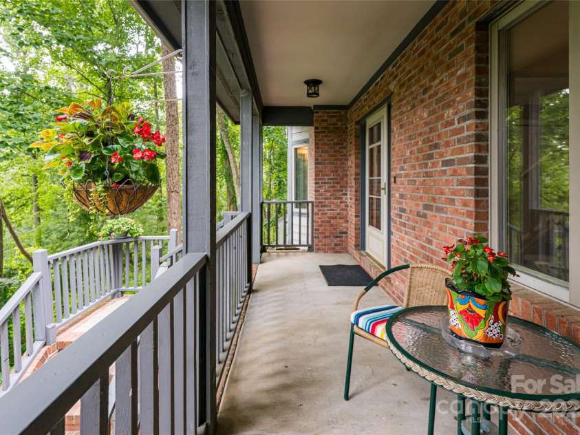 25 Weston Heights Drive, Asheville, NC 28803.  MLS# CAR4285922, YatesRealty ID 32421. Front porch overlooks neighborhood