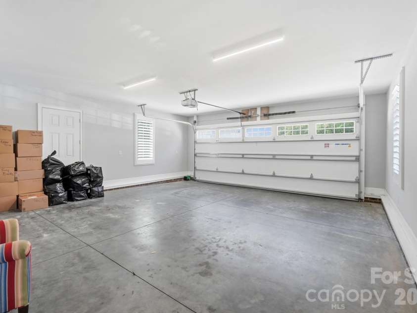 5426 Baker Lane, Lake Wylie, SC 29710.  MLS# CAR4394632, YatesRealty ID 32423. Attached two plus car garage.