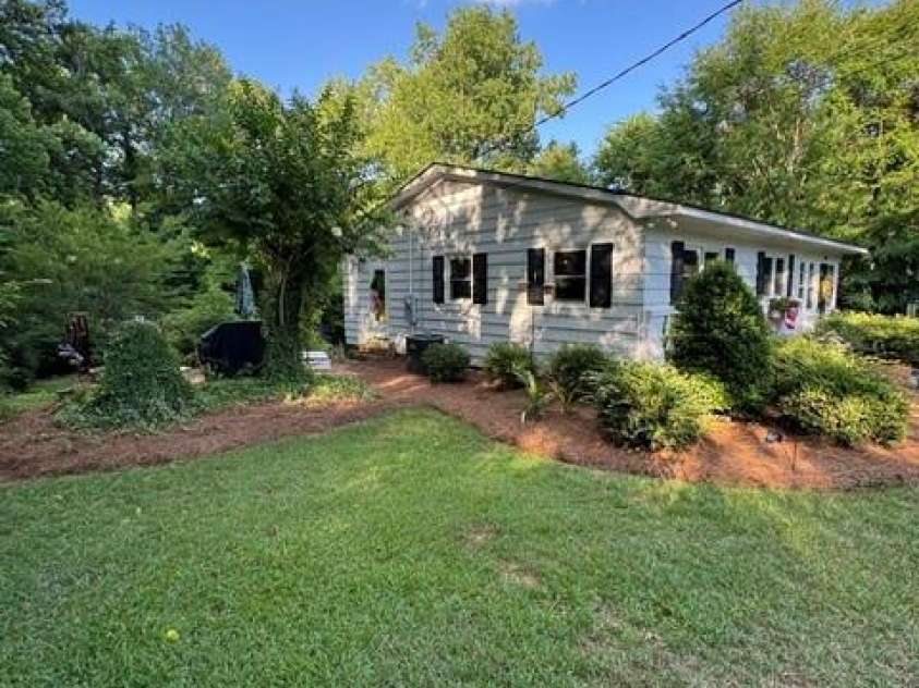 606 Pine Lane, Wadesboro, NC 28170.  MLS# CAR4396579, YatesRealty ID 32424. Left Side View