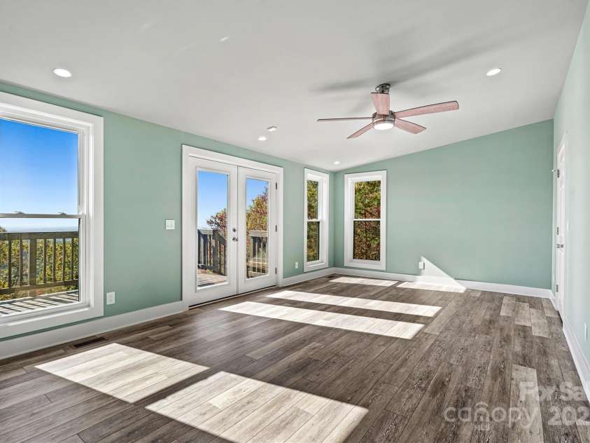 6230 Pine Ridge Drive, Connelly Springs, NC 28612.  MLS# CAR4194799, YatesRealty ID 3243. 2nd Primary Suite with another set of double doors leading out to the amazing deck.