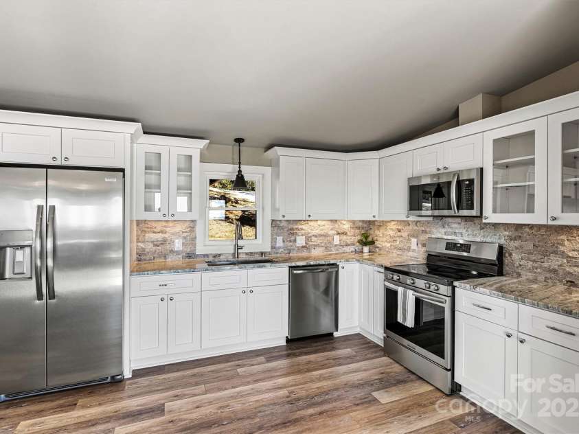 6230 Pine Ridge Drive, Connelly Springs, NC 28612.  MLS# CAR4194799, YatesRealty ID 3243. All new everything AND the refrigerator is INCLUDED. This kitchen is perfect for hosting holidays, parties etc. all the while surrounded by breathtaking views.