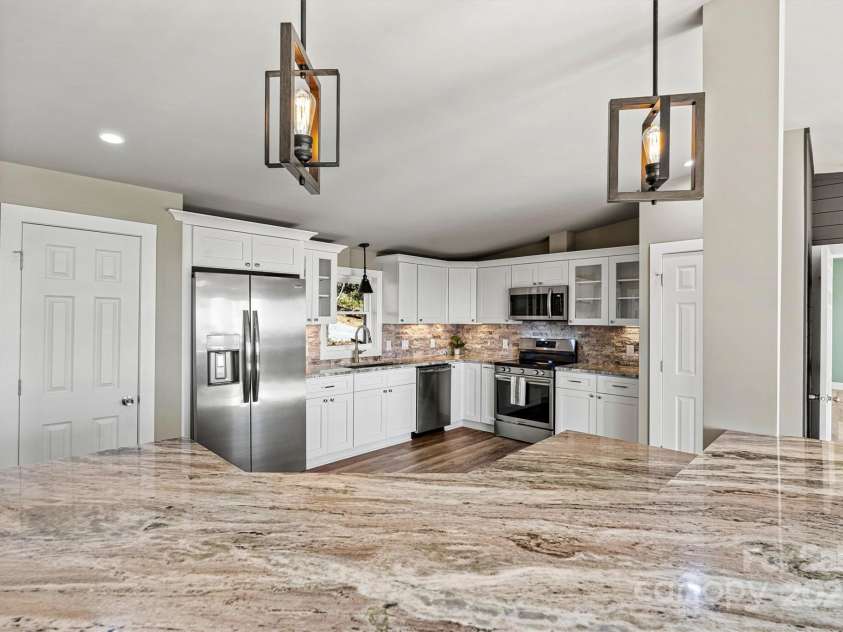 6230 Pine Ridge Drive, Connelly Springs, NC 28612.  MLS# CAR4194799, YatesRealty ID 3243. Coat closet on the left and the pantry is on the right.