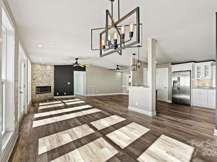 6230 Pine Ridge Drive, Connelly Springs, NC 28612.  MLS# CAR4194799, YatesRealty ID 3243. Dining area with huge windows for dinner with a view!