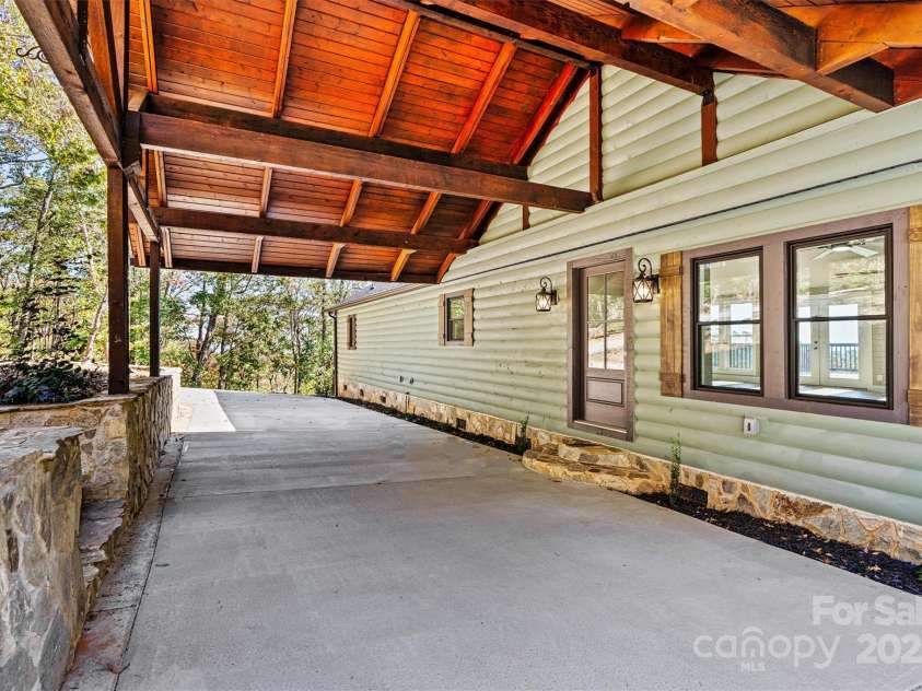 6230 Pine Ridge Drive, Connelly Springs, NC 28612.  MLS# CAR4194799, YatesRealty ID 3243. Don't worry about getting wet if it's raining out with this beautiful carport that welcomes you.