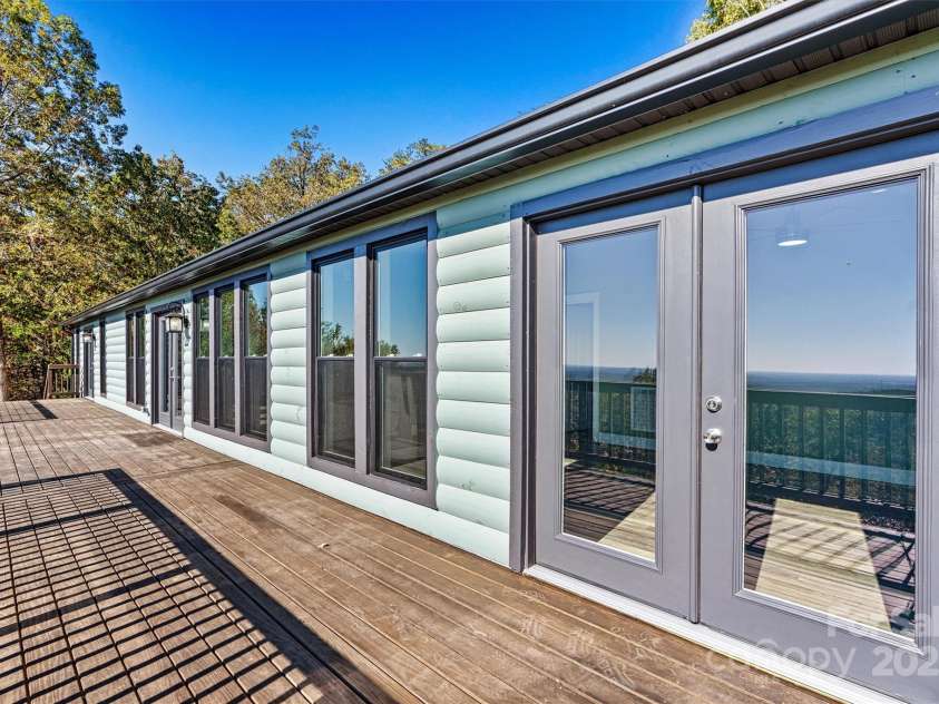 6230 Pine Ridge Drive, Connelly Springs, NC 28612.  MLS# CAR4194799, YatesRealty ID 3243. Freshley painted new log siding.