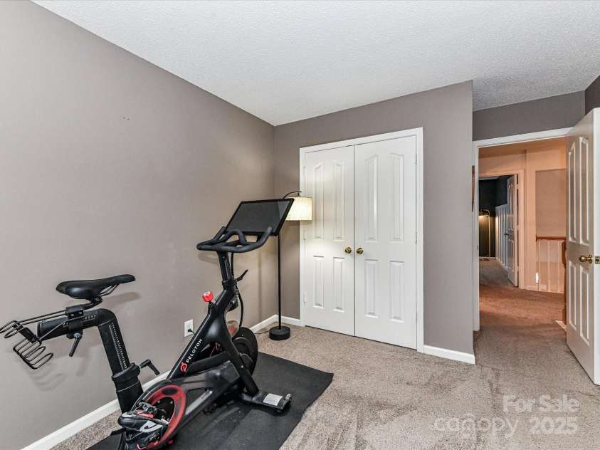 5461 Coleman Circle, Concord, NC 28027.  MLS# CAR4291828, YatesRealty ID 32431. Bedroom #2 with french door closet and lots of natural light