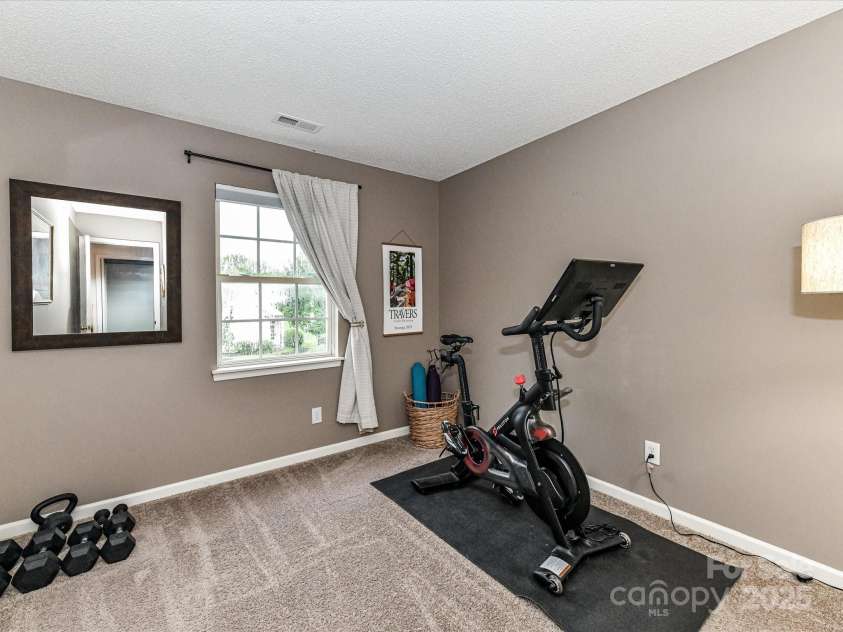 5461 Coleman Circle, Concord, NC 28027.  MLS# CAR4291828, YatesRealty ID 32431. Bedroom #2 with french door closet and lots of natural light
