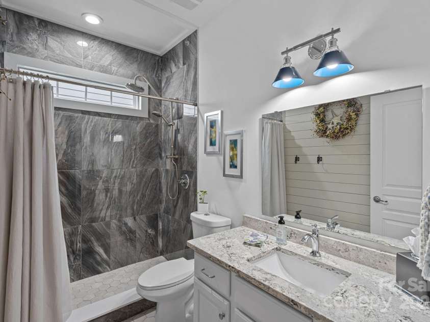 1108 Phar Lap Drive, Indian Trail, NC 28079.  MLS# CAR4290499, YatesRealty ID 32432. Totally Remodeled Full Hall Bathroom! Delux Tiled Shower-Floor to ceiling! New Quartz Vanity, & new tile flooring Batten board novelty wall!