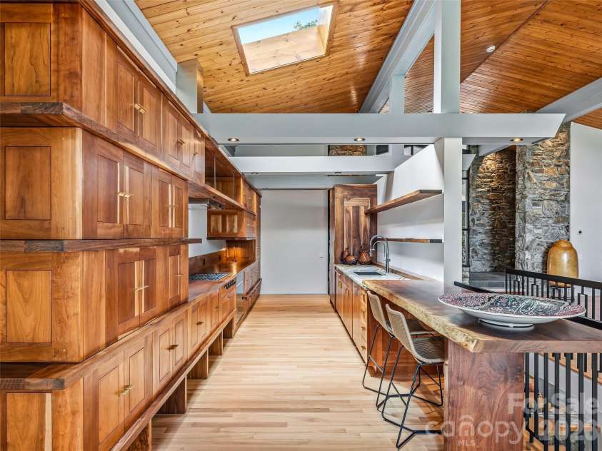 3 Holly Hill Road, Biltmore Forest, NC 28803.  MLS# CAR4396733, YatesRealty ID 32435. Bespoke millwork and linear interest in this fabulous kitchen.
