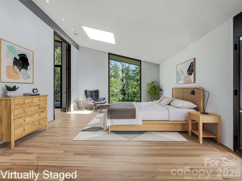 3 Holly Hill Road, Biltmore Forest, NC 28803.  MLS# CAR4396733, YatesRealty ID 32435. Flush overlay pocket doors, hidden LED cove lighting and a geometric skylight frames the trees in the primary.