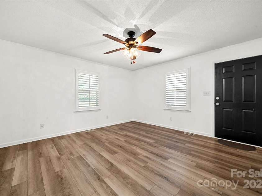 308 Graham Drive, Dallas, NC 28034.  MLS# CAR4292826, YatesRealty ID 32452. Open family living area with vinyl plank flooring throughout