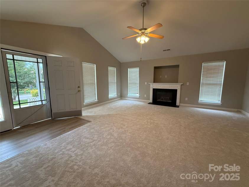 156 Tarrington Drive, Statesville, NC 28625.  MLS# CAR4271748, YatesRealty ID 32457. Living room with fireplace.