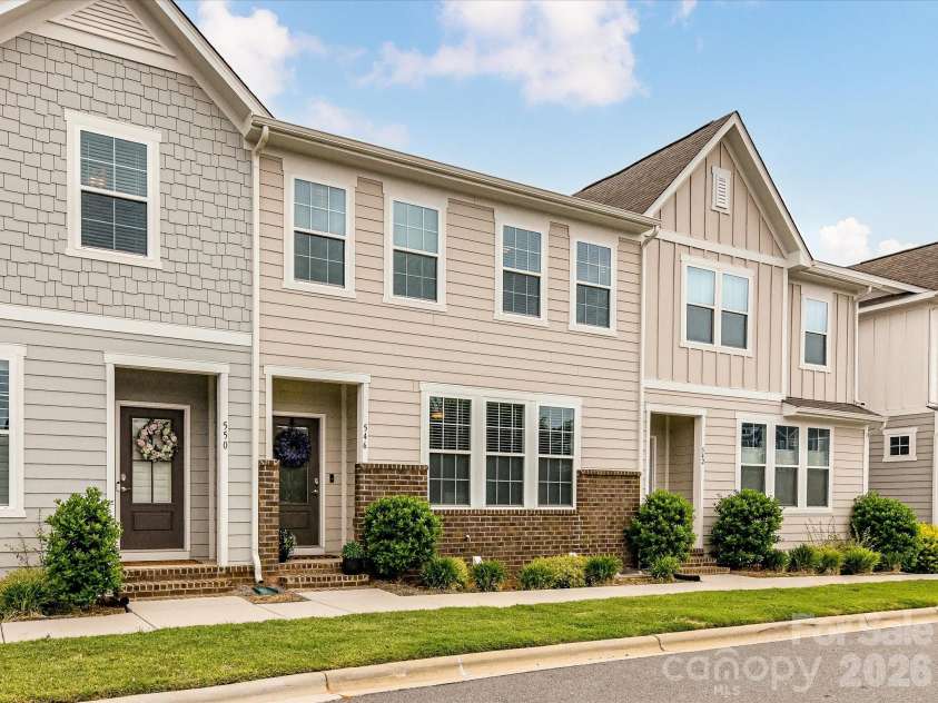 546 Amalfi Drive, Davidson, NC 28036.  MLS# CAR4390990, YatesRealty ID 32467. Charming, low-maintenance townhomes with inviting front entries, manicured landscaping, and modern curb appeal create the perfect setting for comfortable community living.