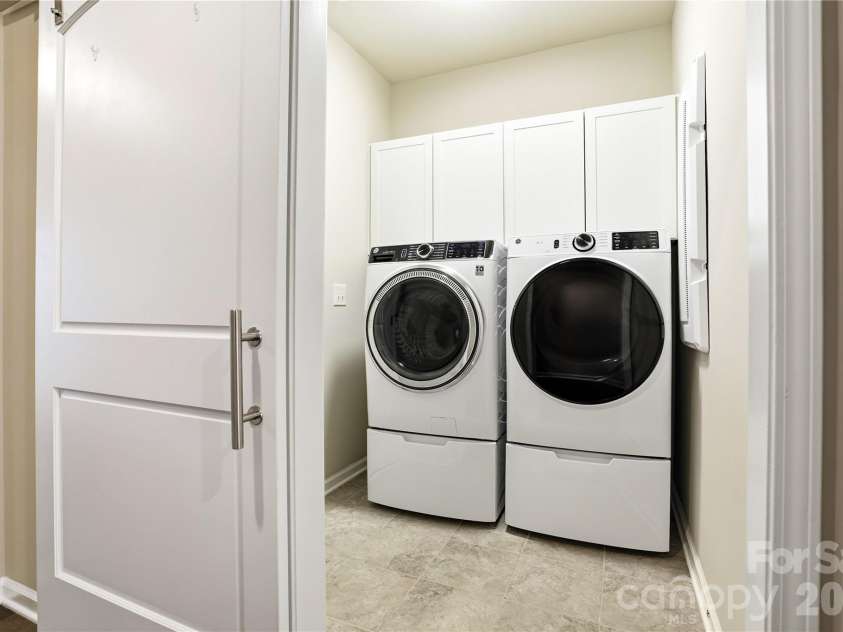 124 Van Gogh Trail, Mount Holly, NC 28120.  MLS# CAR4366924, YatesRealty ID 32468. Laundry Room with Barn Door