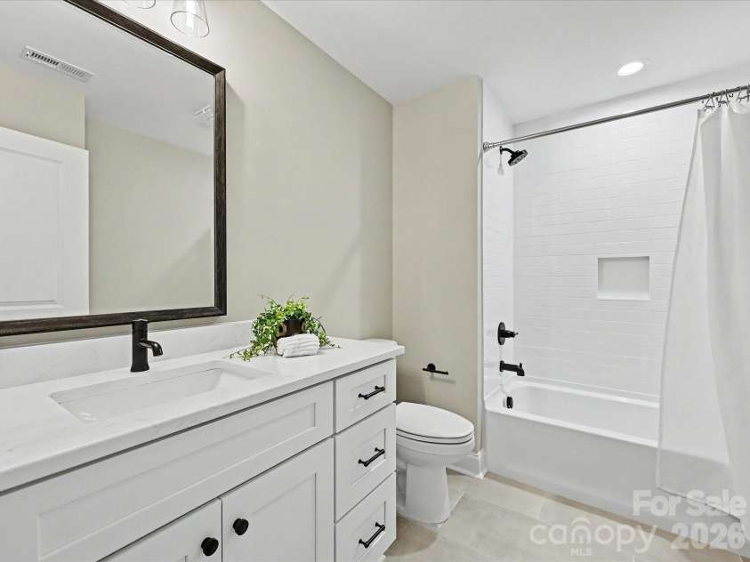 159 Lone Pine Road, Statesville, NC 28625.  MLS# CAR4385296, YatesRealty ID 32469. Stylish second full bath on upper level features modern finishes, a sleek vanity, and a tiled tub/shower combination.