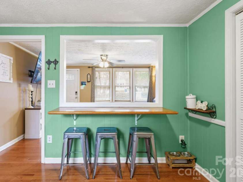121 Morris Avenue, Mount Holly, NC 28120.  MLS# CAR4353340, YatesRealty ID 3247. Kitchen bar looking into Living Room