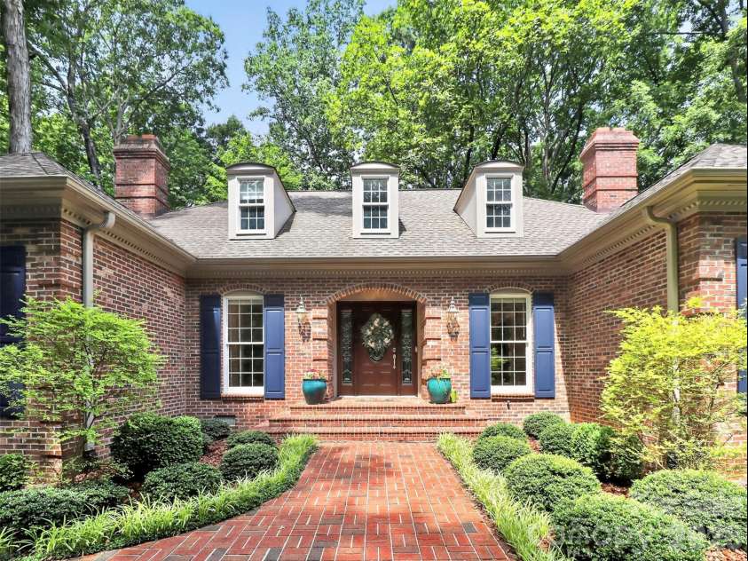 971 Stanley Lucia Road, Mount Holly, NC 28120.  MLS# CAR4388233, YatesRealty ID 32471. Full brick from foundation to roofline with a brick-lined front walk that sets the tone before you ever step inside. Solid, classic, and built to last generations.